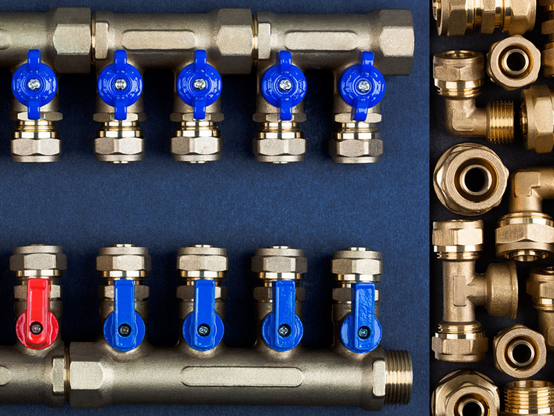 A bunch of pipes and valves are lined up